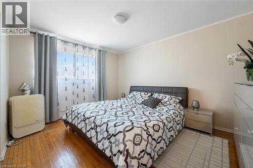 Bedroom with light wood-type flooring and crown molding - 55 Ralgreen Crescent, Kitchener, ON - Indoor Photo Showing Bedroom