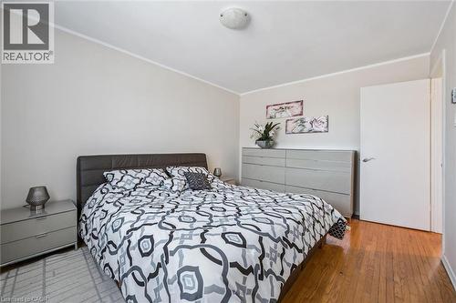 Bedroom with ornamental molding and light wood-type flooring - 55 Ralgreen Crescent, Kitchener, ON - Indoor Photo Showing Bedroom