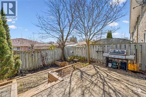 Fenced backyard featuring a garden, a patio area, and a grill - 55 Ralgreen Crescent, Kitchener, ON - Outdoor