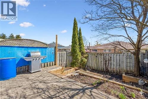 Fenced backyard with a vegetable garden and grilling area - 55 Ralgreen Crescent, Kitchener, ON - Outdoor