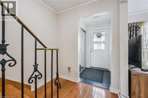 Foyer entrance with crown molding and light wood-type flooring - 55 Ralgreen Crescent, Kitchener, ON - Indoor Photo Showing Other Room