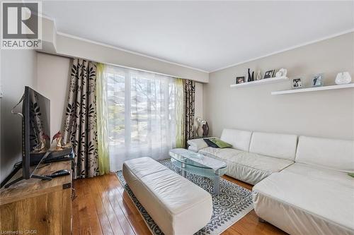 Living area featuring hardwood / wood-style flooring and ornamental molding - 55 Ralgreen Crescent, Kitchener, ON - Indoor Photo Showing Bedroom