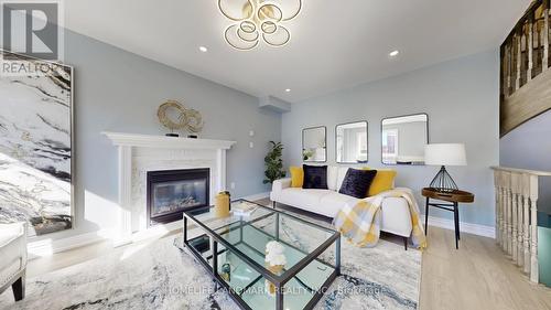 75 Ambler Bay, Barrie, ON - Indoor Photo Showing Living Room With Fireplace