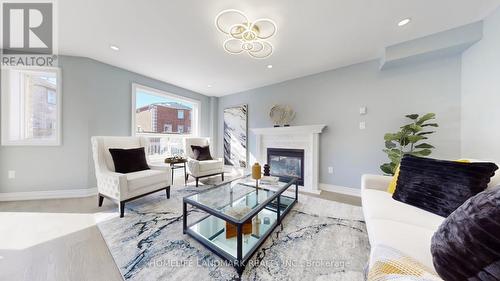 75 Ambler Bay, Barrie, ON - Indoor Photo Showing Living Room With Fireplace