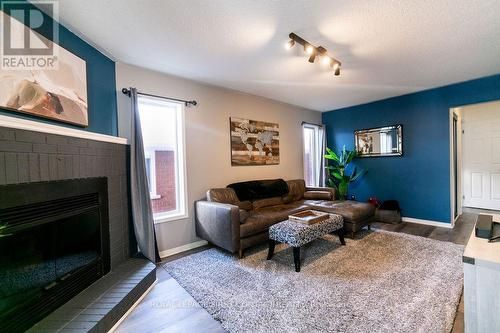 13 Irwin Drive, Barrie, ON - Indoor Photo Showing Living Room With Fireplace