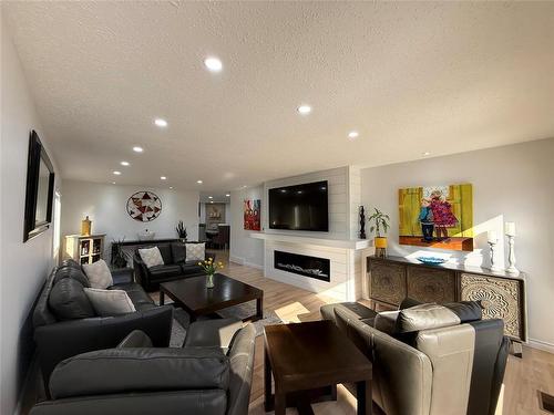 9 Waterloo Crescent, Brandon, MB - Indoor Photo Showing Living Room With Fireplace