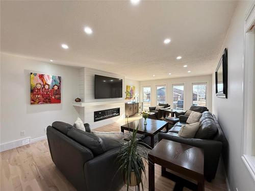 9 Waterloo Crescent, Brandon, MB - Indoor Photo Showing Living Room With Fireplace