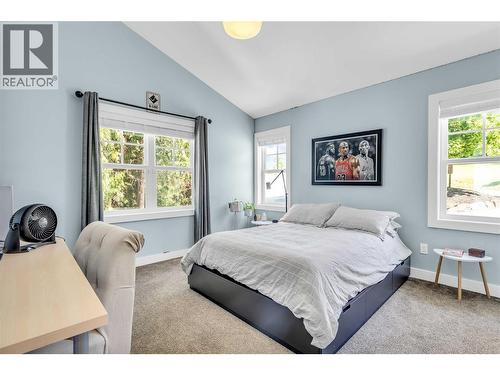 Main level bedroom with ensuite - 2376 Saucier Road, Kelowna, BC - Indoor Photo Showing Bedroom