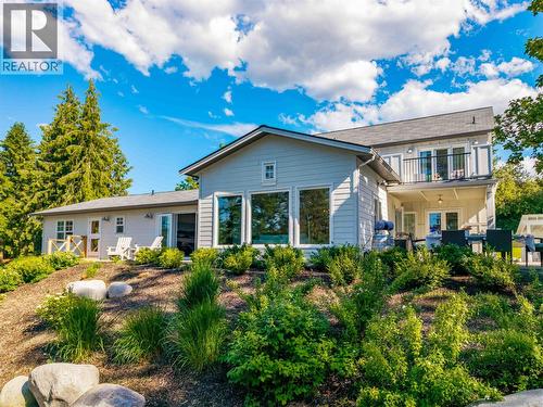 Lush greenery surrounds the home - 2376 Saucier Road, Kelowna, BC - Outdoor