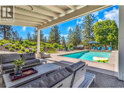 Covered outdoor living space - easy to entertain - 2376 Saucier Road, Kelowna, BC - Outdoor With In Ground Pool With Deck Patio Veranda