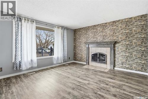 3 Carson Road, Regina, SK - Indoor Photo Showing Living Room With Fireplace