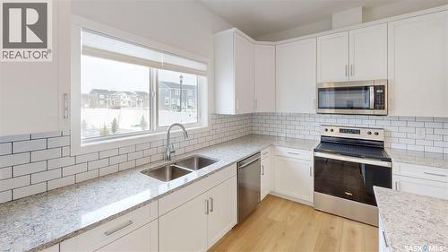 3100 Crosbie Crescent, Regina, SK - Indoor Photo Showing Kitchen With Double Sink