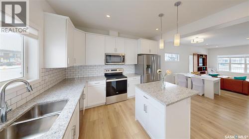 3100 Crosbie Crescent, Regina, SK - Indoor Photo Showing Kitchen With Stainless Steel Kitchen With Double Sink With Upgraded Kitchen