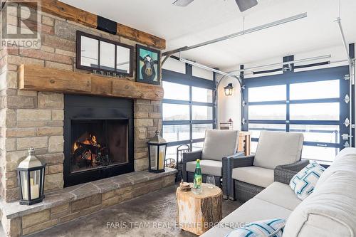 130 Concession 15 W, Tiny, ON - Indoor Photo Showing Living Room With Fireplace