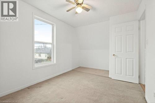 Unfurnished room with ceiling fan, light colored carpet, and vaulted ceiling - 23 Frederick Avenue, Hamilton, ON - Indoor Photo Showing Other Room