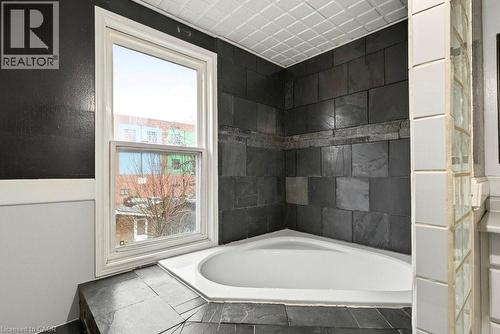 Bathroom with a garden tub - 23 Frederick Avenue, Hamilton, ON - Indoor Photo Showing Bathroom
