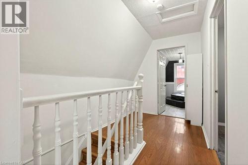 Hall featuring dark wood finished floors and an upstairs landing - 23 Frederick Avenue, Hamilton, ON - Indoor Photo Showing Other Room