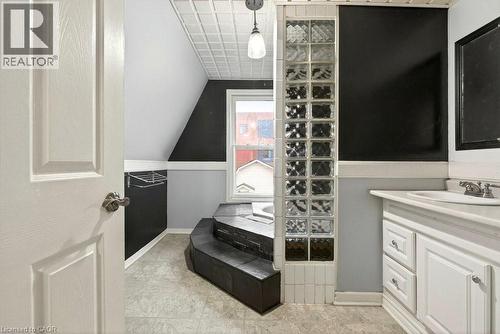 Full bathroom featuring vanity and vaulted ceiling - 23 Frederick Avenue, Hamilton, ON - Indoor