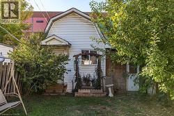 View of side of property featuring a gambrel roof - 