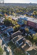 Aerial view of property and surrounding area featuring nearby suburban area - 