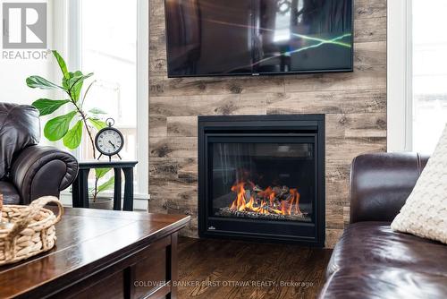 211 Purchase Crescent, Ottawa, ON - Indoor Photo Showing Living Room With Fireplace