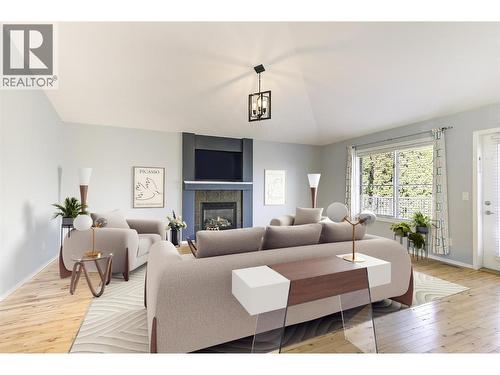 Virtually staged living room - 546 South Crest Drive Lot# 1, Kelowna, BC - Indoor Photo Showing Living Room With Fireplace