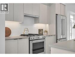 Kitchen. Photos may be of a similar home in the community. - 