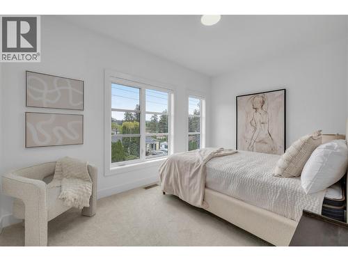 Bedroom 1. Photos may be of a similar home in the community. - 1455 Cara Glen Court Unit# 135, Kelowna, BC - Indoor Photo Showing Bedroom