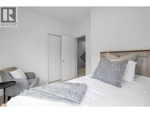 Bedroom 2. Photos may be of a similar home in the community. - 1455 Cara Glen Court Unit# 135, Kelowna, BC - Indoor Photo Showing Bedroom