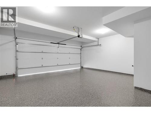Garage. Photos may be of a similar home in the community. - 1455 Cara Glen Court Unit# 135, Kelowna, BC - Indoor Photo Showing Garage