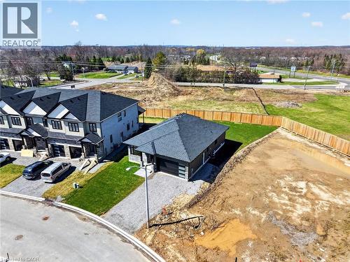 Contemporary single-story residence featuring a dark shingled roof and a paved driveway - 6192 Curlin Crescent, Niagara Falls, ON - Outdoor