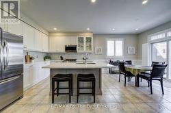 Center island, ceramic floors and backsplash - 