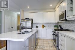 Quartz counters, stainless steel appliances - 