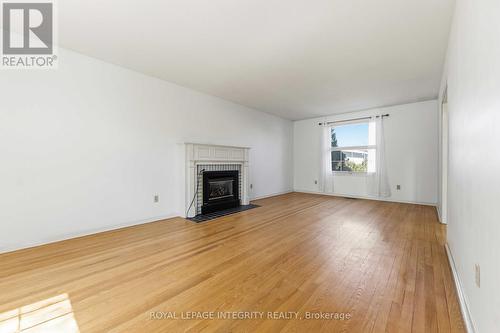 1842 Playfair Drive, Ottawa, ON - Indoor Photo Showing Living Room With Fireplace
