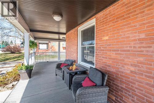 Wooden porch featuring a fire pit - 120 Caithness Street E, Caledonia, ON - Outdoor With Deck Patio Veranda With Exterior