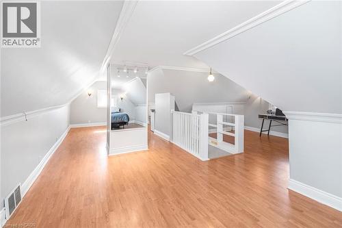 Additional living space featuring light wood finished floors and vaulted ceiling - 120 Caithness Street E, Caledonia, ON - Indoor Photo Showing Other Room
