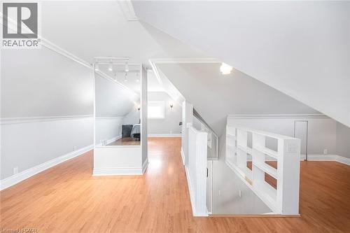 Bonus room featuring light wood finished floors and vaulted ceiling - 120 Caithness Street E, Caledonia, ON - Indoor Photo Showing Other Room