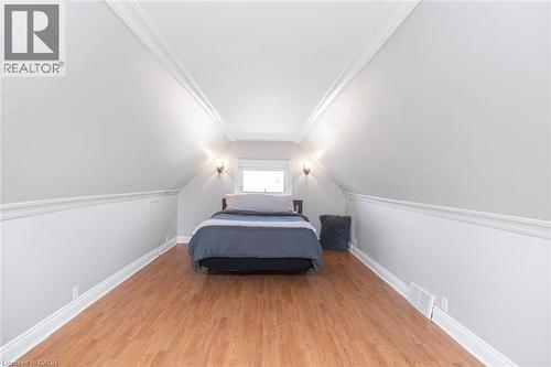 Bedroom with baseboards and light wood-style flooring - 120 Caithness Street E, Caledonia, ON - Indoor