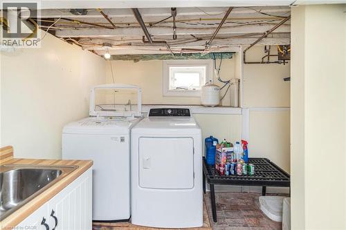 Laundry area with independent washer and dryer - 120 Caithness Street E, Caledonia, ON - Indoor Photo Showing Laundry Room