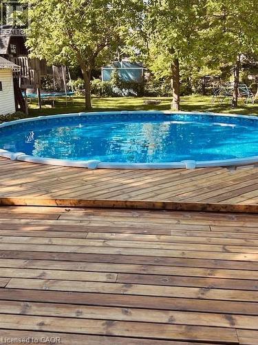 Outdoor pool with a trampoline - 120 Caithness Street E, Caledonia, ON - Outdoor With Above Ground Pool
