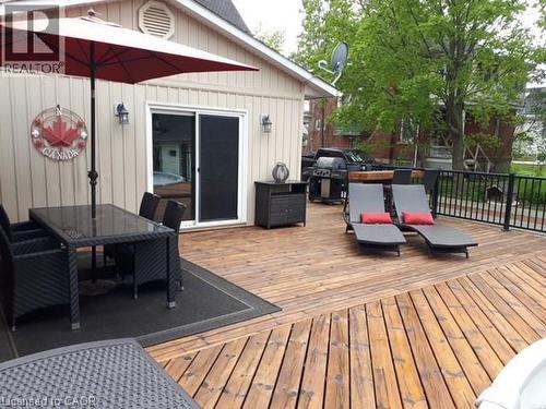 Wooden terrace with outdoor dining space and grilling area - 120 Caithness Street E, Caledonia, ON - Outdoor With Deck Patio Veranda With Exterior