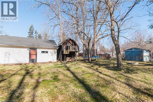 View of yard featuring a trampoline and a deck - 120 Caithness Street E, Caledonia, ON - Outdoor