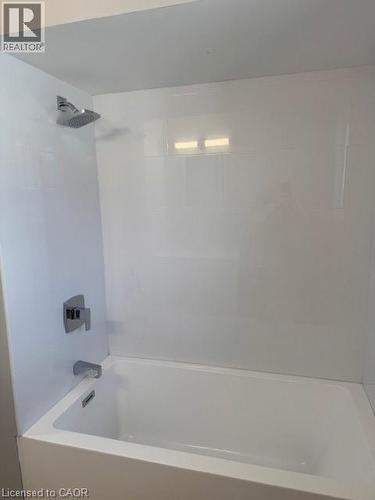 Bathroom featuring washtub / shower combination - 31 Adair Avenue, Hamilton, ON - Indoor Photo Showing Bathroom