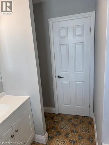 Bathroom featuring vanity and baseboards - 31 Adair Avenue, Hamilton, ON - Indoor