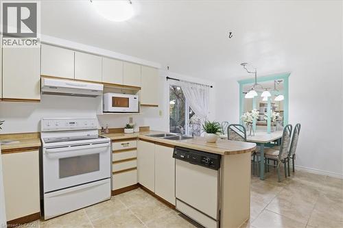Kitchen and breakfast  area - 56 Rushbrook Drive, Kitchener, ON - Indoor Photo Showing Kitchen With Double Sink