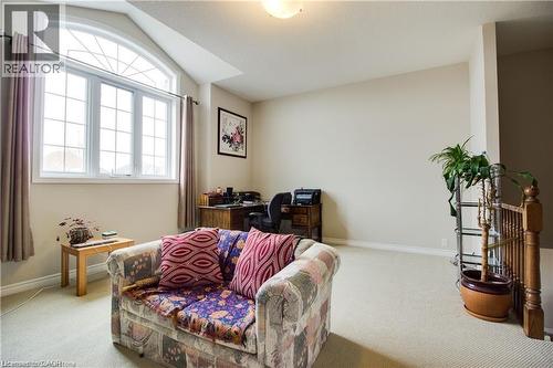 Sitting room featuring carpet flooring and lofted ceiling - 101 Robert Simone Way, Ayr, ON - Indoor