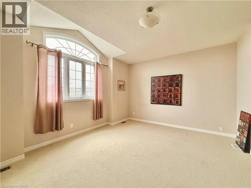 Spare room with light colored carpet - 101 Robert Simone Way, Ayr, ON - Indoor Photo Showing Other Room