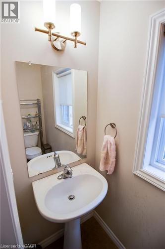 Bathroom with sink, a healthy amount of sunlight, and toilet - 101 Robert Simone Way, Ayr, ON - Indoor Photo Showing Bathroom