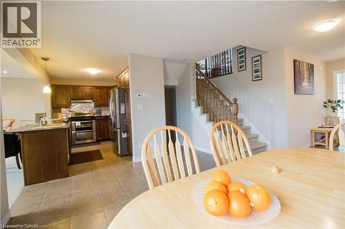 Dining room with sink and light tile patterned floors - 101 Robert Simone Way, Ayr, ON - Indoor Photo Showing Dining Room