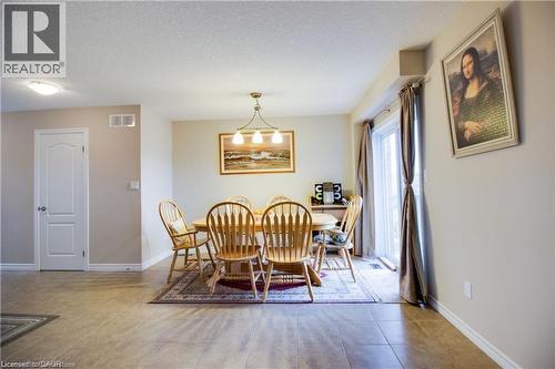 Dining space with a textured ceiling - 101 Robert Simone Way, Ayr, ON - Indoor Photo Showing Dining Room
